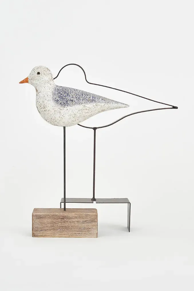 Pájaro de madera con silueta de metal