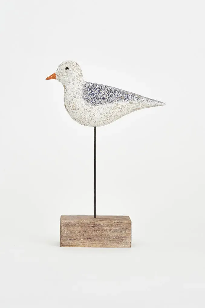 Pájaro de madera con silueta de metal