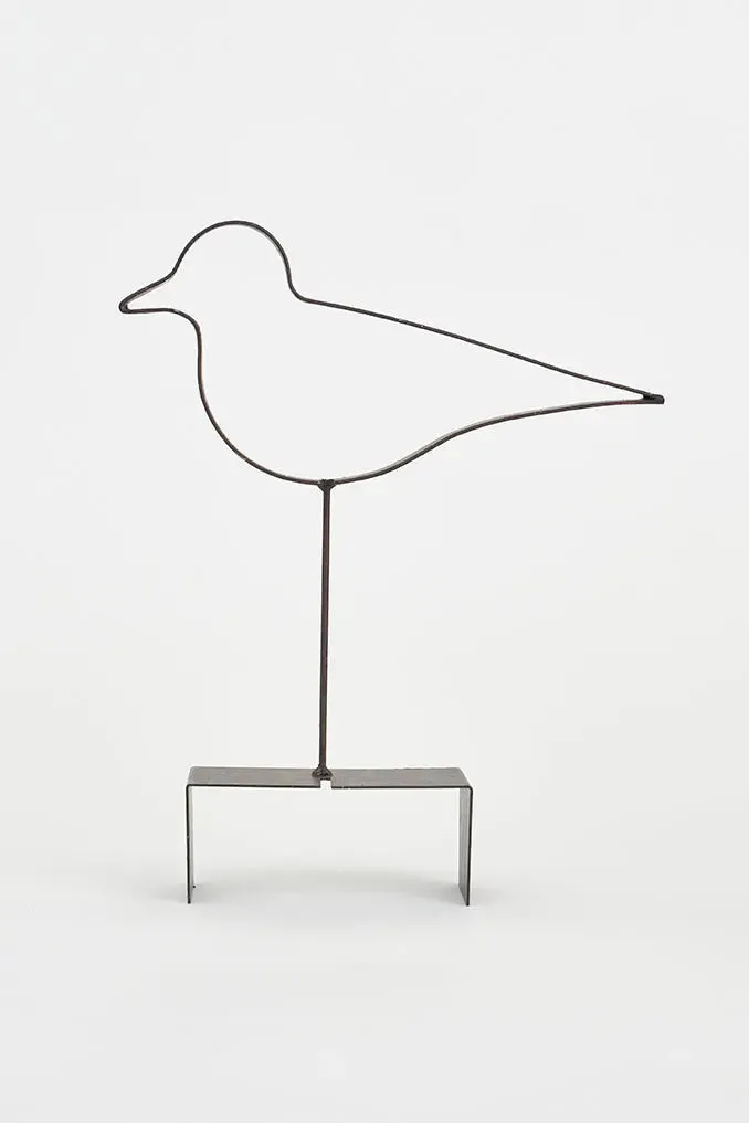Pájaro de madera con silueta de metal