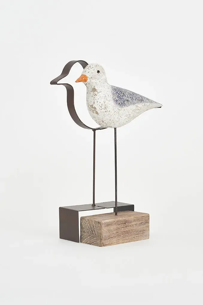Pájaro de madera con silueta de metal